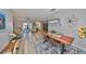 An open dining area with modern lighting and stylish furniture, ideal for Gathering meals and dinner parties at 1805 Columbine Pl, Sun City Center, FL 33573