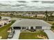 Charming home featuring well-manicured landscaping, covered entryway, and a convenient carport at 1805 Columbine Pl, Sun City Center, FL 33573
