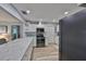 Stylish kitchen features stainless steel appliances, marble countertops, and recessed lighting at 1805 Columbine Pl, Sun City Center, FL 33573