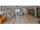 Spacious living room with modern flooring, neutral tones, and ample natural light creates a welcoming atmosphere at 1805 Columbine Pl, Sun City Center, FL 33573