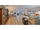 Open-concept living area with new floors flows seamlessly to dining room, great for entertaining and everyday living at 1805 Columbine Pl, Sun City Center, FL 33573