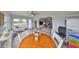 Open concept design connects the sunroom, living room, and kitchen for easy living at 1805 Columbine Pl, Sun City Center, FL 33573