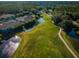 Aerial view showcases the golf course, ponds, and landscaping surrounded by residences at 18186 Sandy Pointe Dr, Tampa, FL 33647