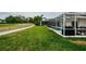 A beautiful backyard featuring a screened-in pool and golf course at 18186 Sandy Pointe Dr, Tampa, FL 33647