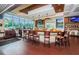 Bar interior with a wooden counter and seating overlooking the grounds in a club setting at 18186 Sandy Pointe Dr, Tampa, FL 33647