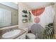 Modern bathroom showcasing a stylish shower curtain and vanity at 18186 Sandy Pointe Dr, Tampa, FL 33647