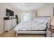 Comfortable bedroom with a large window and white furniture at 18186 Sandy Pointe Dr, Tampa, FL 33647