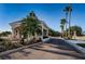 Community entrance featuring stone and stucco construction, a guard house, and mature landscaping at 18186 Sandy Pointe Dr, Tampa, FL 33647