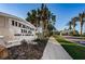 Heritage Isles Golf and Country Club entrance with manicured landscaping and palms at 18186 Sandy Pointe Dr, Tampa, FL 33647