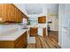 Bright kitchen features wood cabinets, modern appliances, and a cozy breakfast nook with backyard view at 18186 Sandy Pointe Dr, Tampa, FL 33647