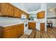 Bright kitchen features wood cabinets, modern appliances, and a cozy breakfast nook with backyard view at 18186 Sandy Pointe Dr, Tampa, FL 33647