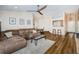 Inviting living room with wood floors, a comfortable couch, and an open layout to the dining area at 18186 Sandy Pointe Dr, Tampa, FL 33647
