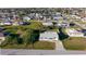 Aerial view of a home with a well-maintained lawn and a driveway at 184 Garden Nw Ave, Port Charlotte, FL 33952