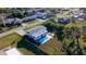 Aerial view of a home with a private backyard swimming pool and partially fenced in yard at 184 Garden Nw Ave, Port Charlotte, FL 33952