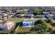 Aerial view of a home with a private backyard swimming pool and partially fenced in yard at 184 Garden Nw Ave, Port Charlotte, FL 33952