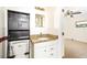 Bathroom with vanity, granite countertop, storage cabinet and tile flooring at 184 Garden Nw Ave, Port Charlotte, FL 33952