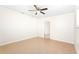 Bedroom featuring tile floors, ceiling fan and doorway to the hallway at 184 Garden Nw Ave, Port Charlotte, FL 33952