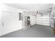 Spacious and clean interior garage view with water heater, mechanical components and white walls at 184 Garden Nw Ave, Port Charlotte, FL 33952