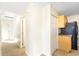 Hallway featuring tile floors and access to the kitchen at 184 Garden Nw Ave, Port Charlotte, FL 33952