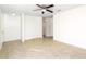 Bright living room with neutral walls, tiled floors, and ceiling fan offers lots of open space at 184 Garden Nw Ave, Port Charlotte, FL 33952