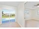 View of a bright living room featuring sliding doors that lead to a private pool at 184 Garden Nw Ave, Port Charlotte, FL 33952