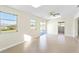 Spacious living room with tile floors, skylight, ceiling fan and windows with natural light at 184 Garden Nw Ave, Port Charlotte, FL 33952