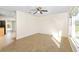 Spacious living room with tile flooring, ceiling fan, and plenty of natural light at 184 Garden Nw Ave, Port Charlotte, FL 33952