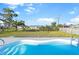 View of the Kidney-shaped pool and well maintained backyard at 184 Garden Nw Ave, Port Charlotte, FL 33952