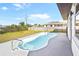 A view of the backyard pool, patio, and part of the fence and house exterior at 184 Garden Nw Ave, Port Charlotte, FL 33952