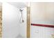 Bathroom shower with white subway tile and granite trim and shower head at 184 Garden Nw Ave, Port Charlotte, FL 33952