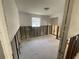 Bedroom with exposed concrete block walls and a large window for natural light at 1924 45Th Street E Ct, Bradenton, FL 34208