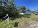 Exterior of a single-story home with a mailbox and an overgrown front yard on a sunny day at 1924 45Th Street E Ct, Bradenton, FL 34208