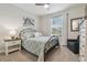 Bedroom with a wrought iron bed and a large window at 19477 Coastal Shore Ter, Land O Lakes, FL 34638