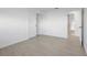 Bright bedroom with wood floors and a white sliding-door closet creates a modern, minimalist appeal at 1984 Kansas Ne Ave, St Petersburg, FL 33703