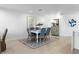Bright dining room features a modern table set, stylish decor, and plenty of natural light at 1984 Kansas Ne Ave, St Petersburg, FL 33703