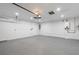 Spacious and well-lit garage with a clean, concrete floor and ample room for parking and storage at 1984 Kansas Ne Ave, St Petersburg, FL 33703