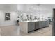 Open-concept kitchen with a large island, modern appliances, and access to the dining area at 1984 Kansas Ne Ave, St Petersburg, FL 33703
