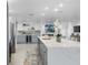 Bright open kitchen with stainless steel appliances, quartz countertops, and a wine refrigerator at 1984 Kansas Ne Ave, St Petersburg, FL 33703