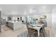 Open-concept living area with dining space and access to the kitchen and waterfront views at 1984 Kansas Ne Ave, St Petersburg, FL 33703