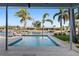 Relaxing pool area with lush palm trees and waterway views for a tranquil outdoor experience at 1984 Kansas Ne Ave, St Petersburg, FL 33703