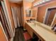Well-lit bathroom featuring a long vanity, tile flooring, and modern fixtures at 1988 Georgia S Cir, Clearwater, FL 33760