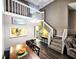 Charming dining area featuring high ceilings and staircase leading to upper level at 1988 Georgia S Cir, Clearwater, FL 33760