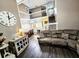 Comfortable living space with hardwood floors, staircase, and ample natural light at 1988 Georgia S Cir, Clearwater, FL 33760