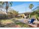 Secluded backyard featuring tropical landscaping and a covered patio at 200 S Bayshore Blvd, Clearwater, FL 33759