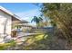 Exterior view of backyard with partial privacy fence, patio, and shade trees at 200 S Bayshore Blvd, Clearwater, FL 33759