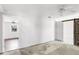 Spacious bedroom featuring a ceiling fan and access to the closet with rustic sliding barn door at 200 S Bayshore Blvd, Clearwater, FL 33759