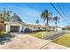 Single-story home with attached garage, well-kept lawn and picket fence at 200 S Bayshore Blvd, Clearwater, FL 33759