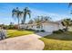 Single-story home with a white picket fence, driveway, and a well-manicured lawn at 200 S Bayshore Blvd, Clearwater, FL 33759