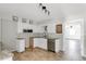 This bright kitchen boasts stainless steel appliances, granite counters, tile flooring and farmhouse sink at 200 S Bayshore Blvd, Clearwater, FL 33759