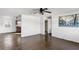 Open living room with wood-look tile flooring, connecting to the kitchen and other rooms at 200 S Bayshore Blvd, Clearwater, FL 33759